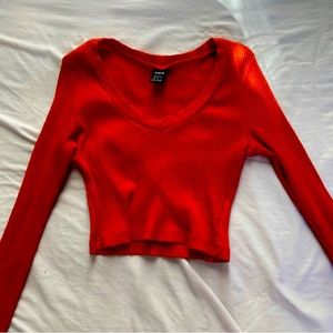 Red cropped long sleeve shirt